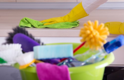 Cleaner handling sorted recycling materials in London