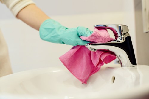 Cleaner preparing a London apartment for house cleaning