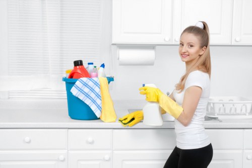 Team carrying out end of tenancy cleaning in a London flat kitchen