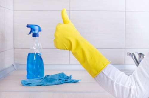 Professional house cleaning in a London flat with careful attention to surfaces and floors
