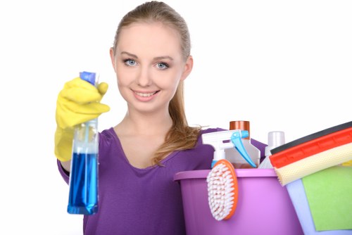 Local oven cleaner working in a busy London house kitchen